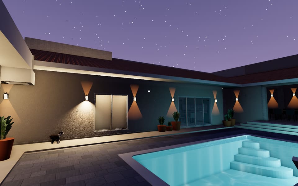 Piscina às 20h30, de noite, com as arandelas do projeto acesas.